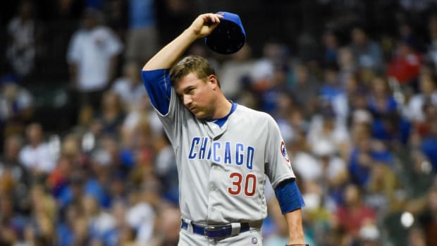 Sep 7, 2016; Milwaukee, WI, USA; Chicago Cubs pitcher Joe Smith (30) reacts after giving up a home run to Milwaukee Brewers third baseman Jonathan Villar (not pictured) in the eighth inning at Miller Park.